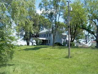 18.373 Acres (13 acres of productive cropland w/0.5 acres of CRP waterways).

- 3 Miles to I-70 exchange.
- 1800's Brick Federal home w/2700 SF.
- Stocked pond for family recreation.
- 1700 Ft. of road fronatage.
- A mix of woodland and tillable land. - 18.373 Acres with Country Home